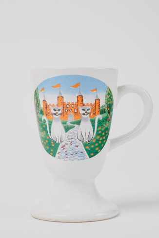 Close-up view of Vintage cup Small white ceramic cup with illustration