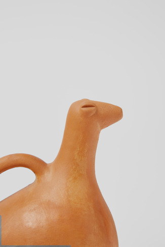 Close-up view of Pigeon-shaped baby feeder Handcrafted terracotta baby feeder