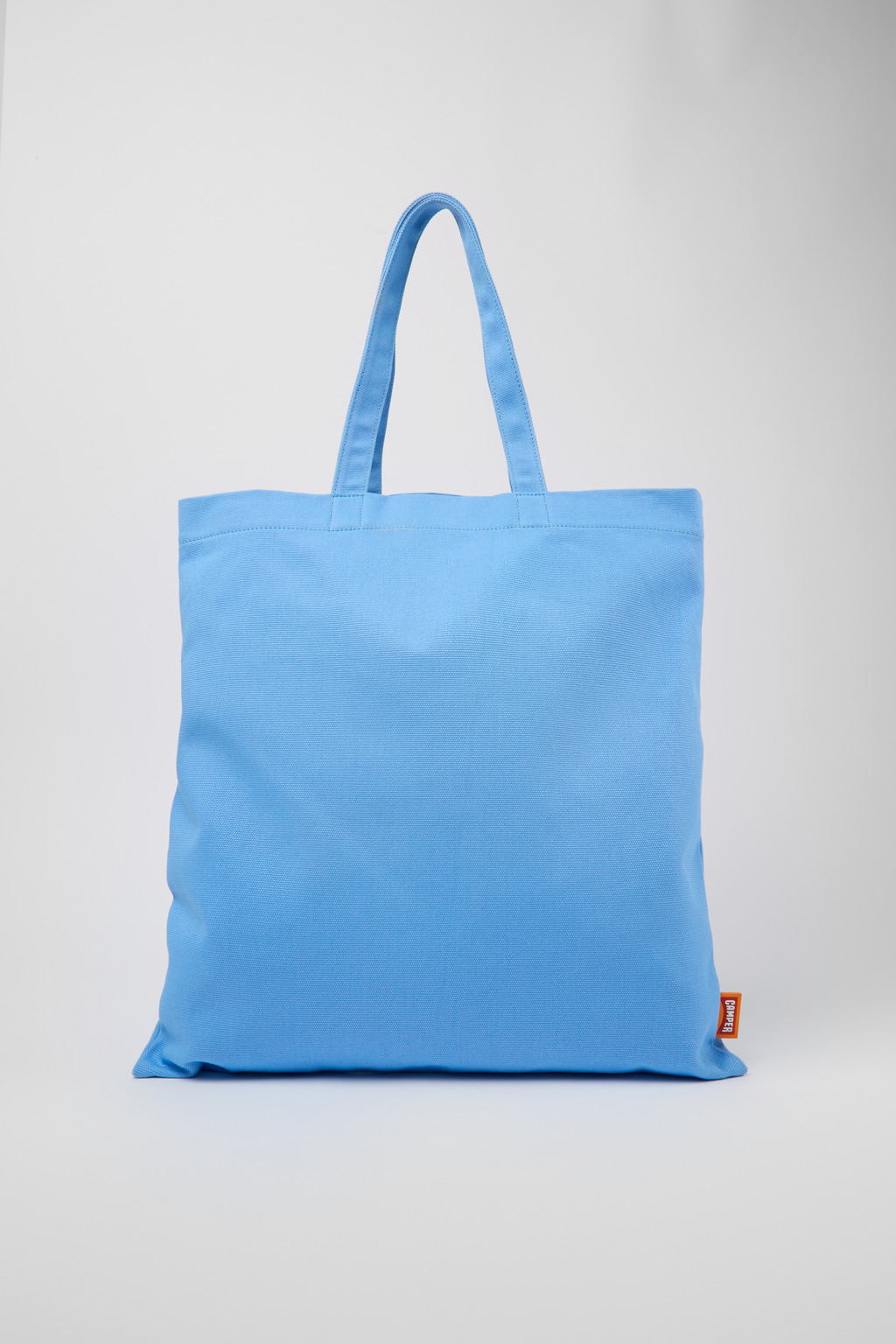 ConMigo Blue, orange, and black tote bag